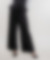 Le pantalon noir taille haute en laine et polyester est un pantalon taille haute avec des jambes larges