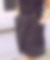 Zoom sur la jupe à bretelles NADIA, une jupe asymétrique en laine à rayures noires et blanches avec des bretelles amovibles et des boucles argentées au niveau de la ceinture. La jupe est Made in France à partir de tissu de stocks dormants